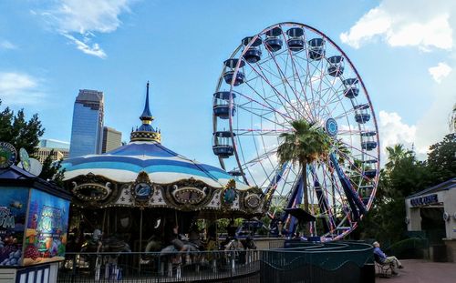 Ferris wheel against buildings