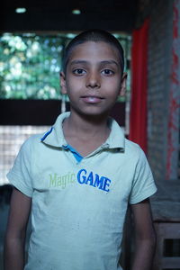 Portrait of boy standing outdoors