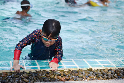 Boy in swimming pool