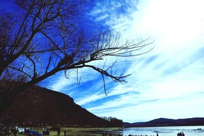 Scenic view of calm river against sky