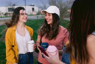 Young woman smiling while standing outdoors