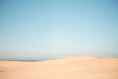 Scenic view of desert against clear sky