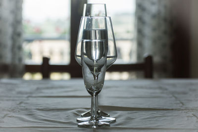 Close-up of wineglass on table at home