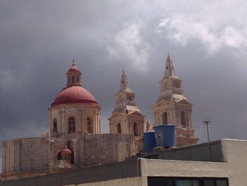 High section of building against cloudy sky