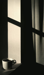 Close-up of coffee cup on table