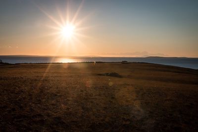 Sun shining over beach