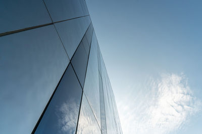 Low angle view of sailboat against blue sky