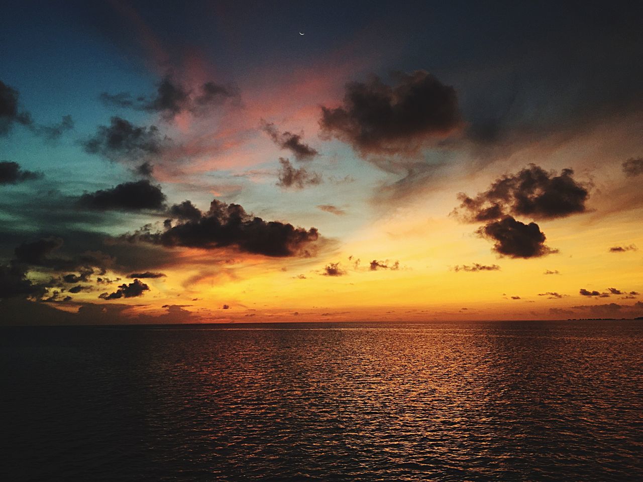 sunset, sea, scenics, water, tranquil scene, beauty in nature, horizon over water, tranquility, sky, orange color, nature, idyllic, cloud - sky, cloud, outdoors, dramatic sky, remote, no people, majestic, cloudy, non-urban scene, calm, seascape, rippled, ocean, sun, non urban scene, weather