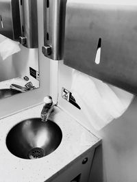 Close-up of faucet in bathroom