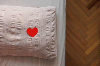 Close-up of heart shape on bed