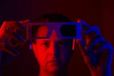 Close-up portrait of man using mobile phone