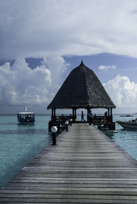 Pier over sea against sky