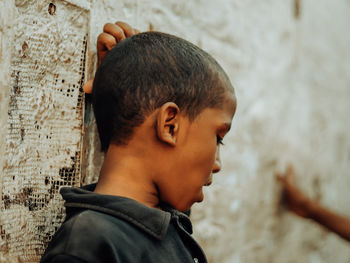 Side view of young man looking away