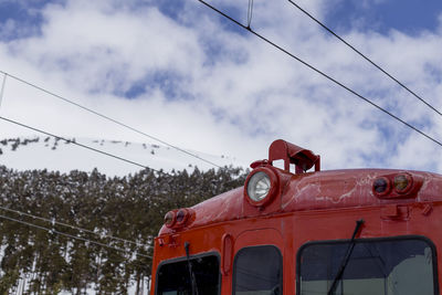 Low angle view of train against sky