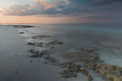 Scenic view of sea against sky at sunset