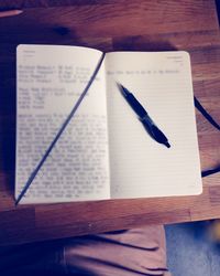 Close-up of book on wooden table