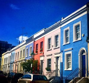 Low angle view of buildings against clear blue sky