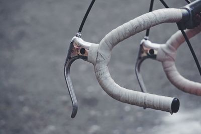 Close-up of bicycle handlebar on road