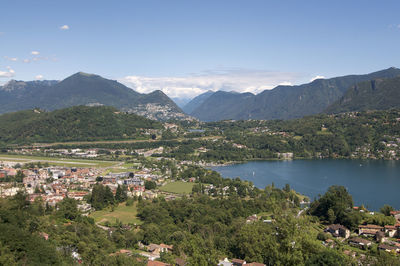 Scenic view of lake and mountains against sky