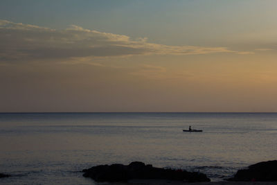 Scenic view of sea at sunset