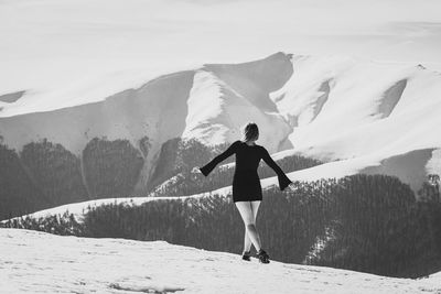 Female model in dress on mountain monochrome scenic photography