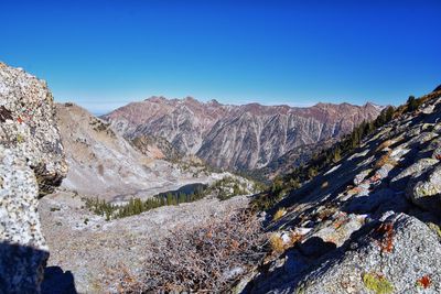 Scenic view of mountains against clear blue sky