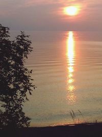 Scenic view of sea against sky at sunset