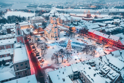 High angle view of street amidst buildings during winter