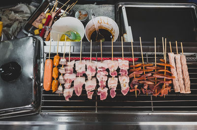 High angle view of meat on barbecue grill