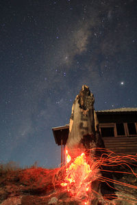 Digital composite image of fire against sky at night