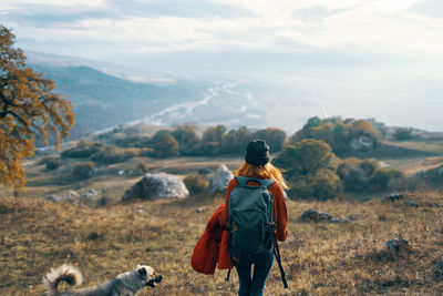 Rear view of man walking on land