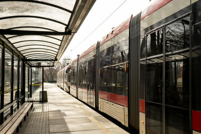 Public transport scene in gdansk. empty transport stop. no people tram arrives at the tram stop