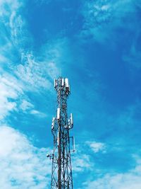 Low angle view of communications tower against sky