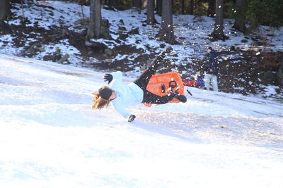 Man skiing on snow covered field