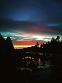 Scenic view of silhouette landscape against sky during sunset
