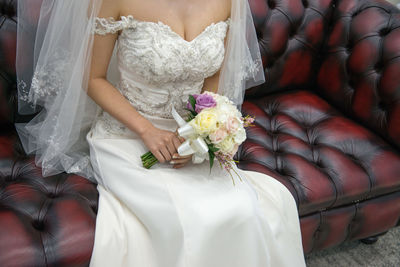 Close-up of woman holding flower bouquet