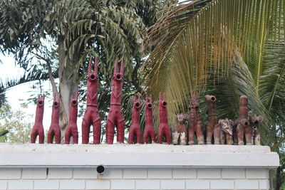 Low angle view of statue against trees