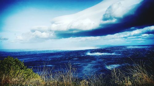 Panoramic view of landscape against blue sky