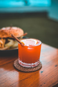 Close-up of orange juice on table