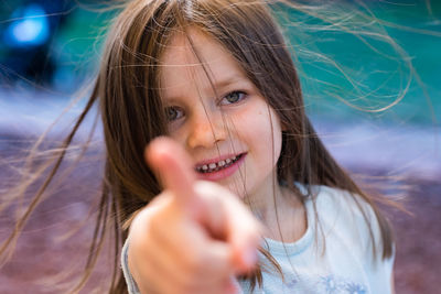 Close-up portrait of smiling young woman