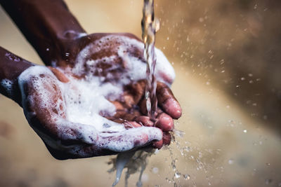 Close-up of hand holding water