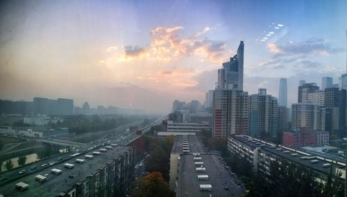 High angle view of buildings against sky during sunset