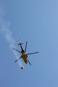 Low angle view of airplane flying in sky