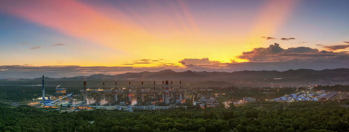 Scenic view of field against sky during sunset. coal power plant.