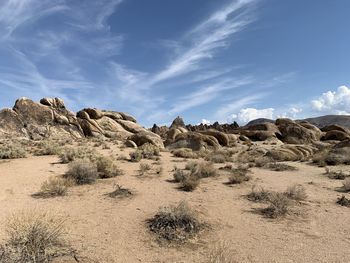 Panoramic view on rocks in a desert with little bushes