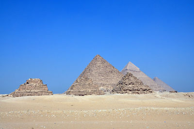 Ancient building against clear blue sky, giza pyramid in egypt