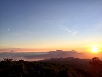 Scenic view of landscape against sky during sunset