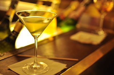 Close-up of martini served on table