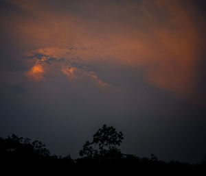 Silhouette of trees against sky at sunset