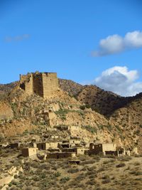 Old ruin building against blue sky